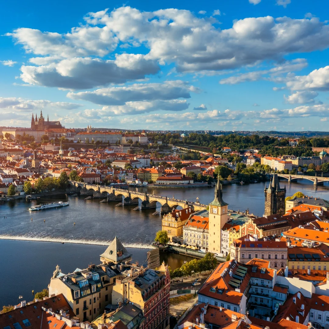 Aerial view of Prague with Charles Bridge, the Vltava River and Prague Castle at sunset